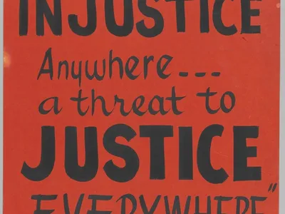 A black ink on a red-orange poster board with a small picture of Martin Luther King, Jr. at the top left and Joseph Lowery at the top right. The poster reads: [SCLC / INJUSTICE / Anywhere... / a threat to / JUSTICE / EVERYWHERE / M. L. KING].