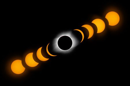 This series was captured over the course of three hours from St. Louis Missouri. Look closely at the right edge of the fully eclipsed sun and you can see a large solar flare.