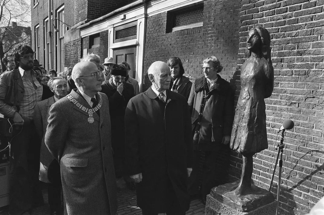 Otto Frank (center) attends the 1977 inauguration of a statue of his daughter Anne