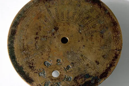 The back of an ancient sundial reveals a cheat sheet of locations and latitude coordinates.