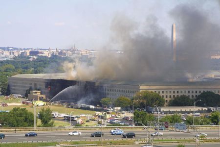 Smoke pours from the west wing of the Pentagon building September 11, 2001 in Arlington, Virginia, after a plane crashed into the building and set off a huge explosion.