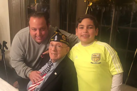Philip Kahn, pictured on his 100th birthday with his grandson, Warren Zysman, and great-grandson