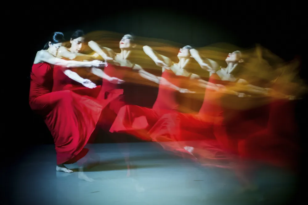 OPENER - Xin Ying, principal dancer with Martha Graham Dance Company, wears a costume from the 1948 ballet Diversion of Angels. Graham designed the dress, inspired by a splash of  color in a Wassily  Kandinsky painting.