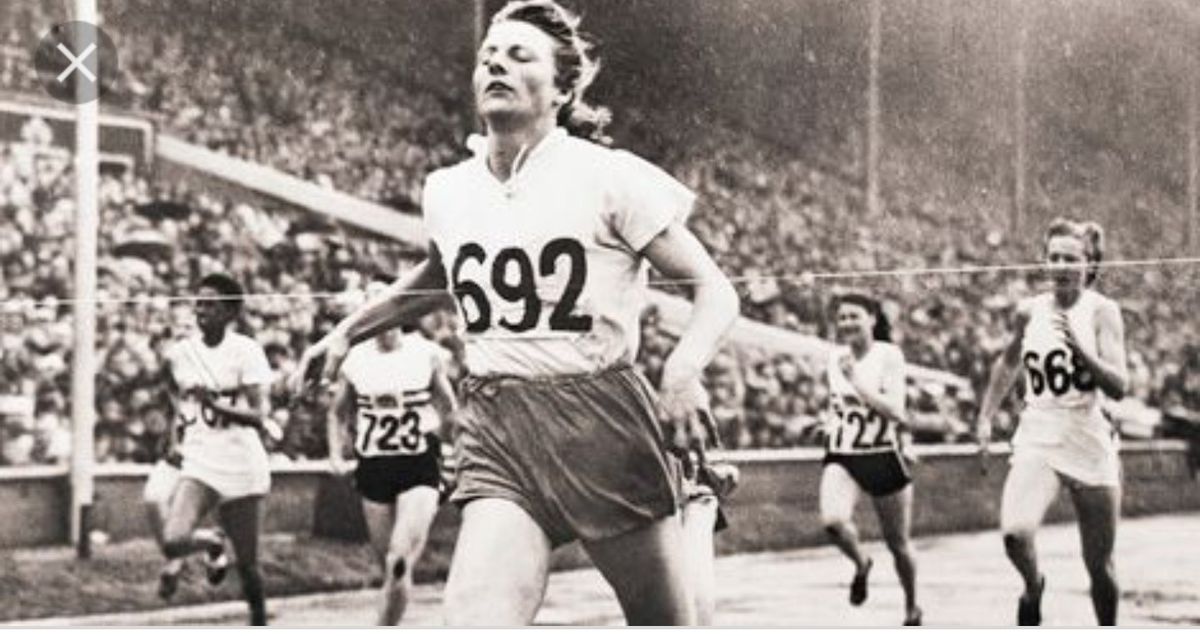 Fanny Blanker-Koen crosses the finish line to become the first triple champion of the 14th Olympic Games.