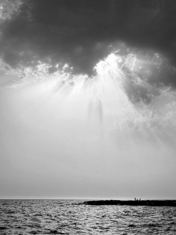 Dramatic sky and far people thumbnail