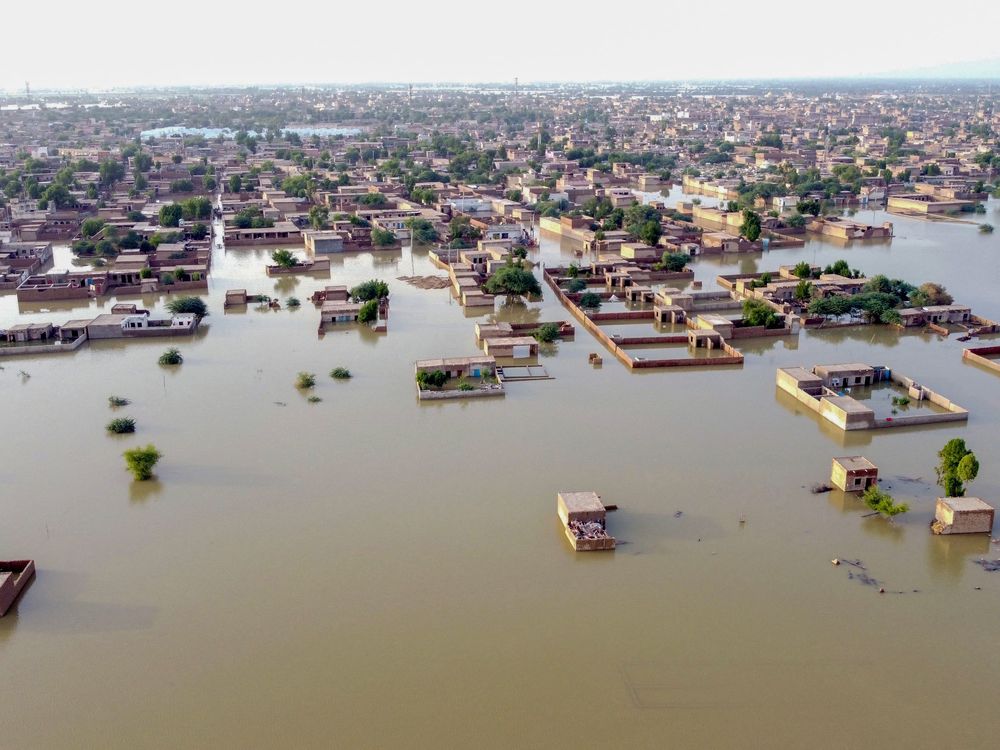 An aerial view showing a heavily flooded residential area in Pakistan.