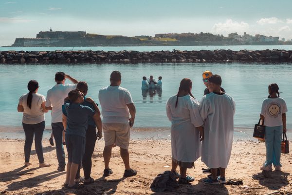 Baptism ceremony at Islas de Cabras with El Morro fort backdrop thumbnail