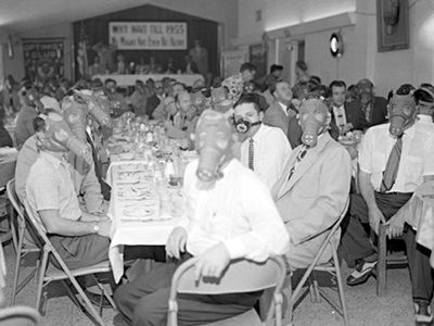 Angelenos wearing smog masks at a banquet, circa 1954.