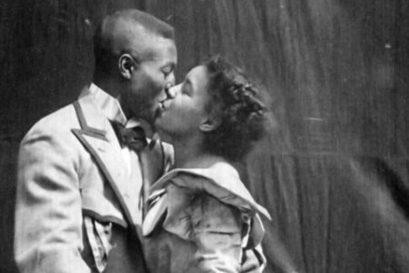 Saint Suttle and Gertie Brown embrace in the 1898 film 'Something Good-Negro Kiss.'