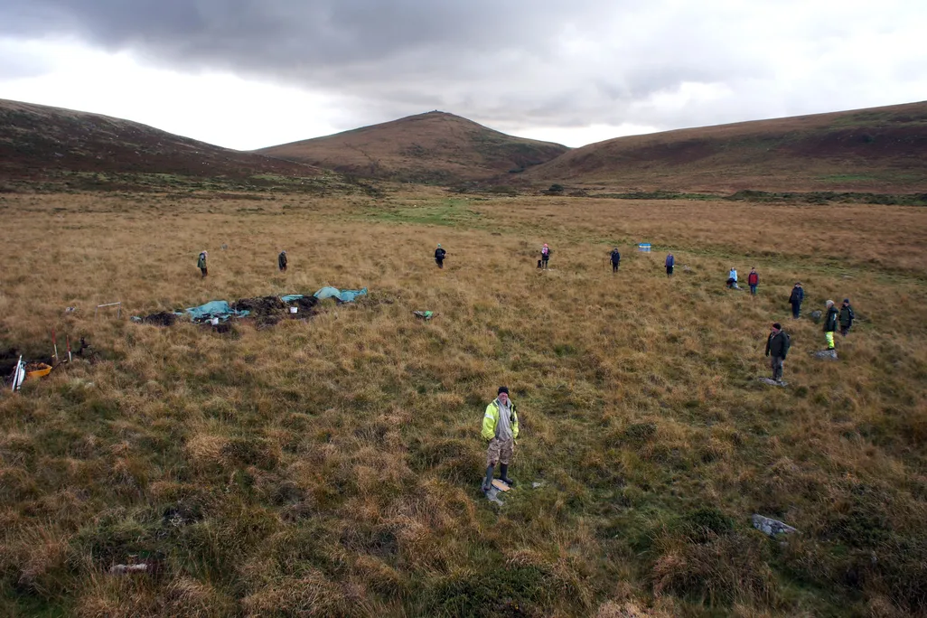 The team stands around the Metheral stone circle