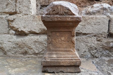 The altar's inscription suggests pilgrims traveled great distances to reach the religious site.