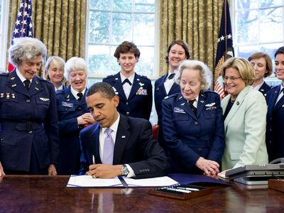 President Barack Obama signs legislation in 2009 awarding a Congressional Gold Medal to Women Airforce Service Pilots.