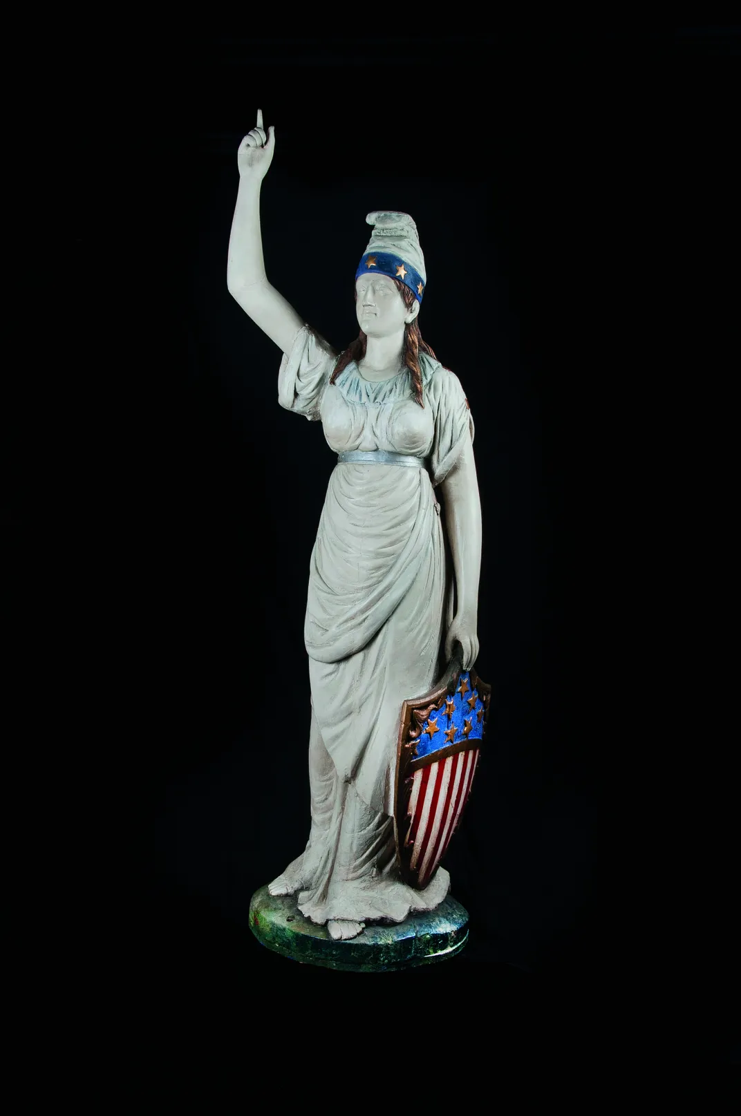 six-foot-plus Lady Columbia carved in wood.