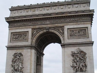 Traffic whips around Paris' grandest arch while tourists savor the view from the top.