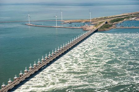 The Oosterscheldekering (Eastern Scheldt storm surge barrier), between the islands Schouwen-Duiveland and Noord-Beveland, is the largest of the 13 ambitious Delta Works series of dams and storm surge barriers, designed to protect the Netherlands from flooding from the North Sea.