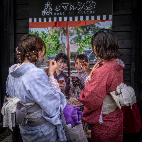 Two Young Japanese Girls having a snack thumbnail