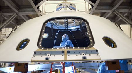 Technicans work on the Mars Science Laboratory, aka Curiosity