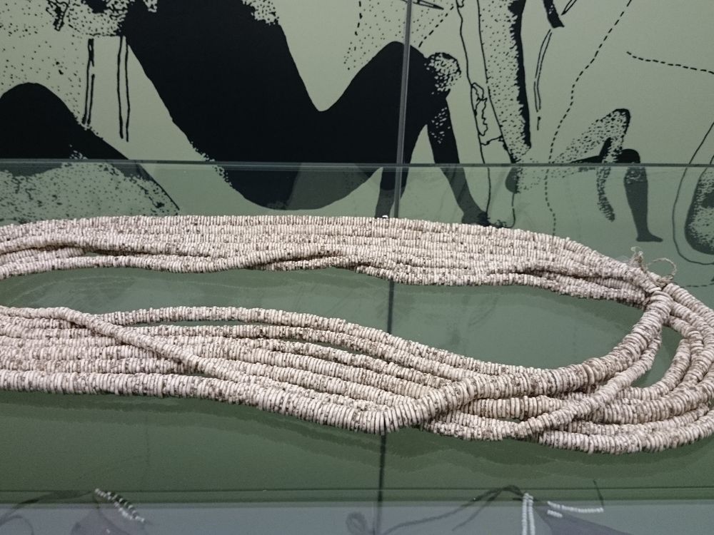 several necklaces of ostrich beads