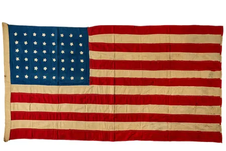 Using the encyclopedia as a guide, a group of Islay villagers worked through the night stitching together a Stars and Stripes.
