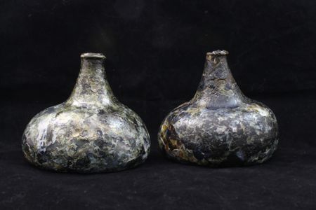 Layers of glass were flaking off the bottles due to a process known as "delamination." Conservators coated the artifacts with an acrylic resin to help preserve them.