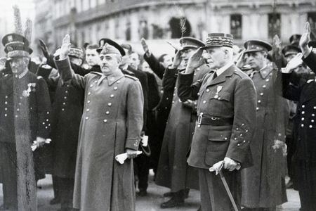 Spanish dictator Francisco Franco (left) and Philippe Petain (right), head of state for Vichy France, salute during the French national anthem during a meeting in Montpelier, France, March, 1941.