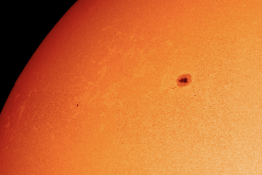 a portion of the sun in high resolution depicting a large sunspot