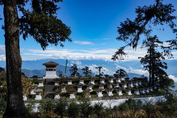Chortens and Himalayas stand together at the top of the Docula La Pass. thumbnail