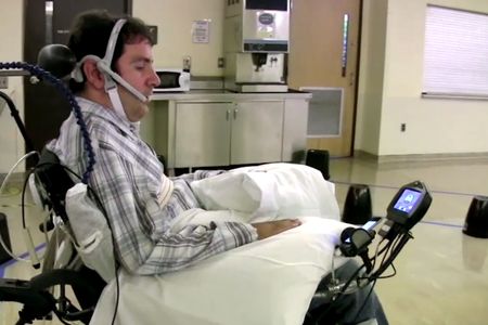 Paralyzed patient Jason Disanto navigates through a room full of obstacles by guiding the wheelchair with his tongue.