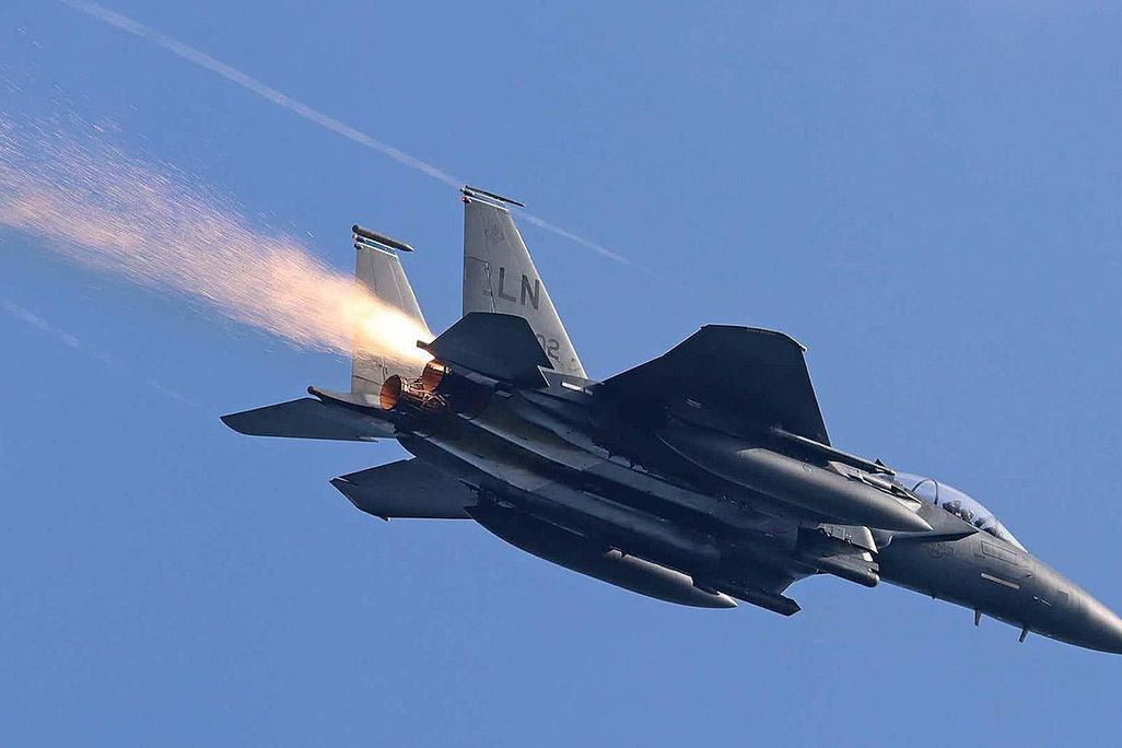 sparks trailing behind F-15E Strike Eagle