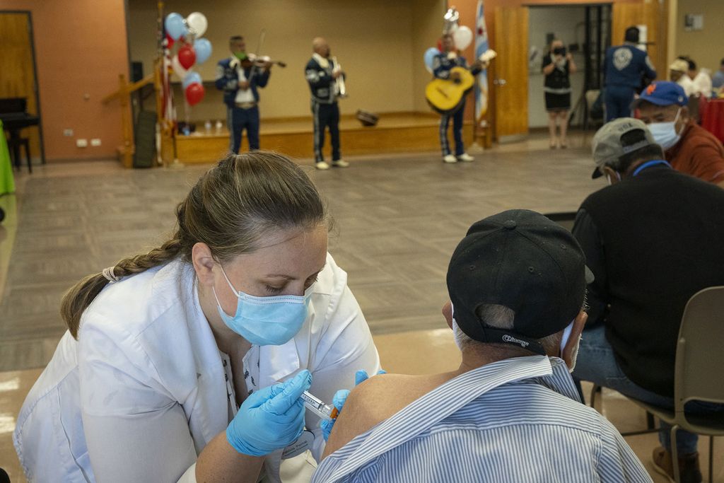 Nurse Administers Covid Booster Shot