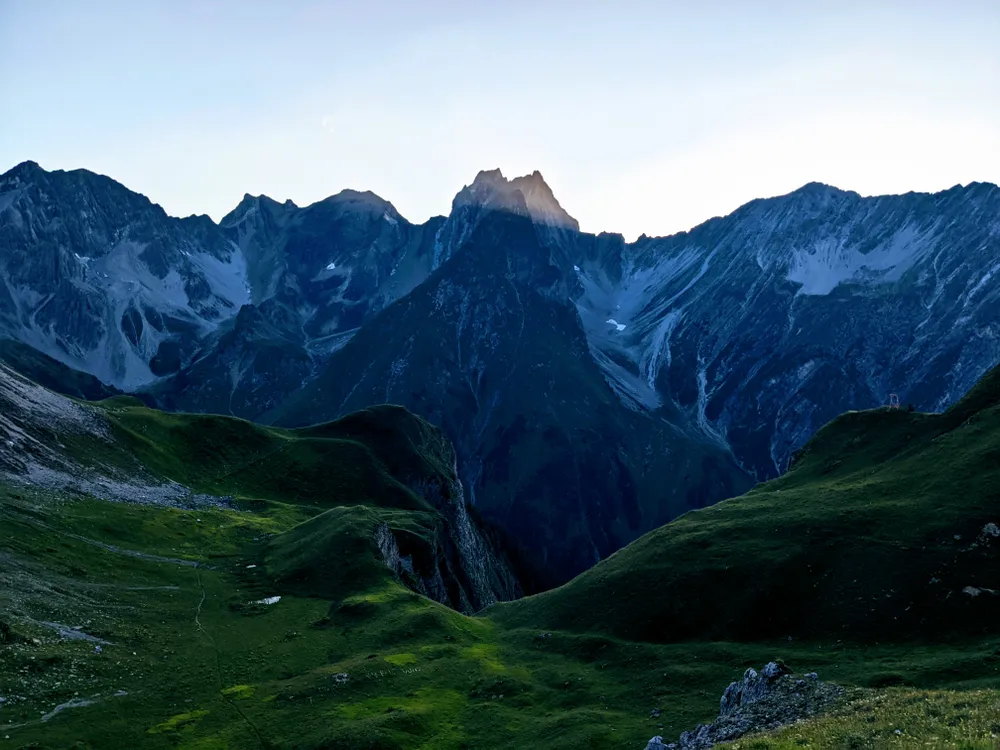 Mountain peaks at dusk weaving through the Austrian Alps.