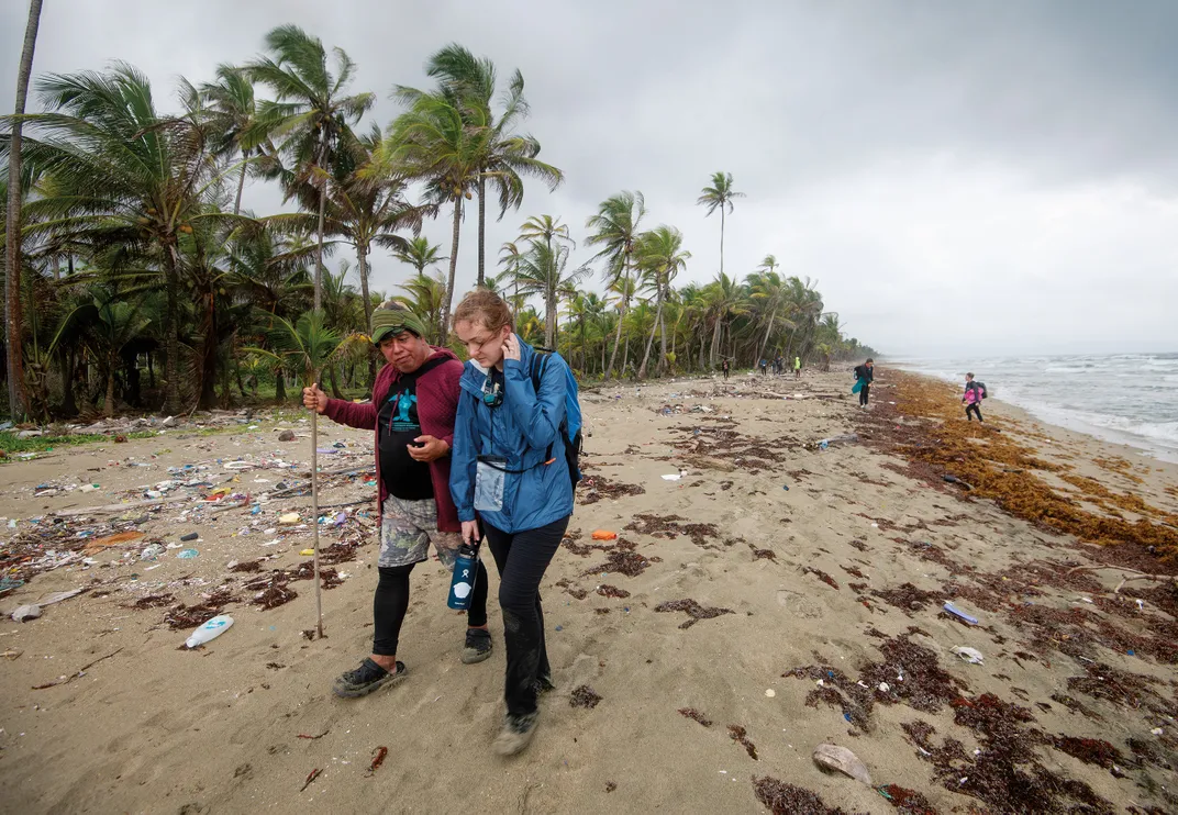 After a night patrol, Veelenturf walks with Marino Abrego, left, chief of the oceans and marine division of Panama’s Ministry of Environment.