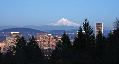 On Portland’s eastern skyline, the white pyramids of Mount Hood and Mount St. Helens are visible on clear days.