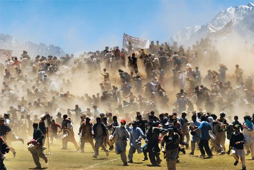 A bomb scare sends spectators of a polo match onto the field