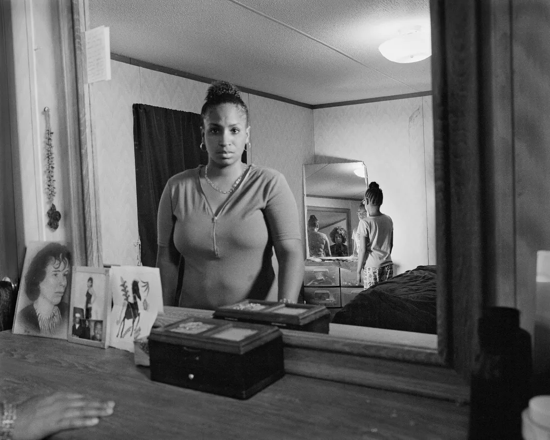 Self-Portrait with Shea and Her Daughter, Zion, in the Bedroom Mirror