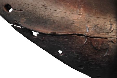 Part of a 600-year-old canoe was found in New Zealand, featuring this rare carving of a sea turtle.