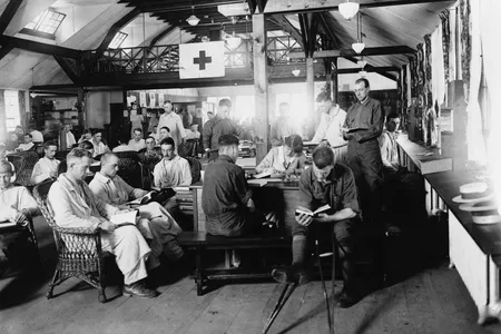 United States World War I soldiers reading in the War Library Service section of the Red Cross building at Walter Reed Hospital.