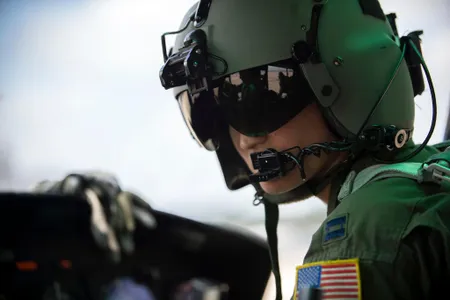 A U.S. Air Force pilot performs a pre-flight check. Perhaps one day, connecting electrodes to the scalp could be part of that routine.