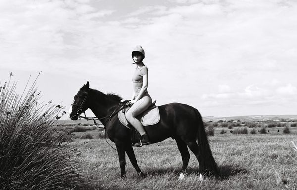 Lone woman on horse thumbnail