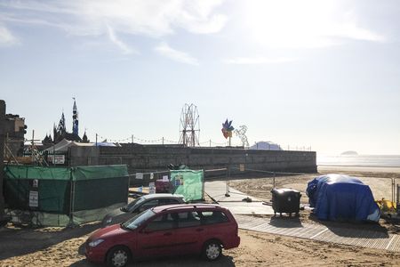 Weston-super-mare, United Kingdom. 18th August 2015 -- A structure of a sinister fairy castle can be seen in Weston-super-Mare. High security has been put in place. Image courtesy of Martyn East on Instagram. -- Fans of street artist Bansky expect whispers of a secret sinister pop-up exhibition called 'Dismaland' in seaside town to be true. A fairy castle structure, like a sinister twist on Disneyland, can be seen by locals from Weston-super-mare beach.