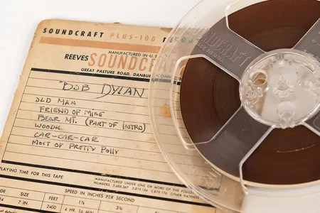 The reel-to-reel tape features four original Dylan compositions, including &quot;Song to Woody.&quot;
