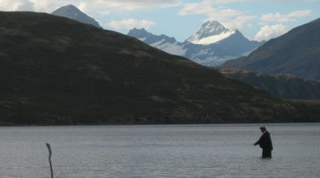 Andrew Bland casts for trout during a moment’s peace between passing power boats and jet skis on Lake Wanaka. Mount Aspiring stands in the background, untroubled by the commotion.