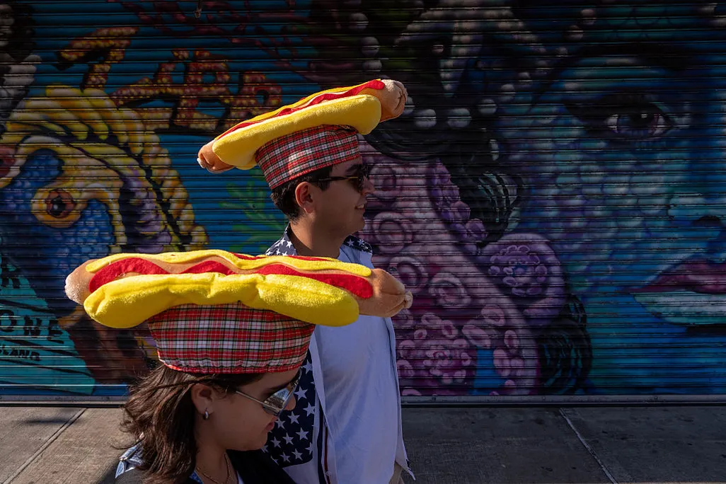 two spectators of Nathan's Annual Hot Dog Eating Contest