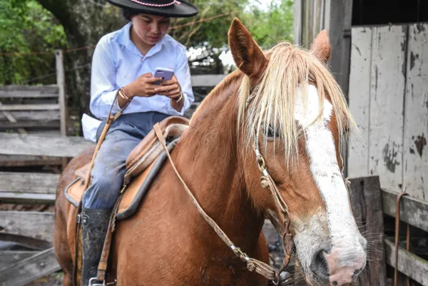 Cowgirl Luise, her horse and her cellphone. thumbnail