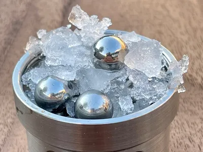 Part of the set-up for the experiment: ordinary ice and steel balls placed in a jar