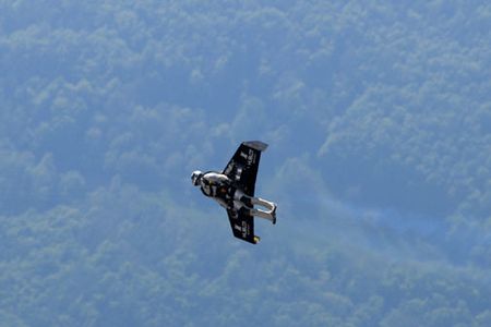 Swiss adventurer Yves Rossy crosses the English Channel in his home-built, jet-powered wing.