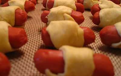 Making pigs in a blanket was a "true test of patience and stealth" for the author.