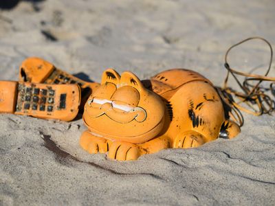 For more than 30 years, plastic Garfield phones have been washing up on French beaches