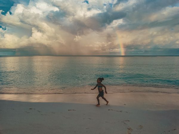 Girl running by the sea on the island of San Andrés thumbnail