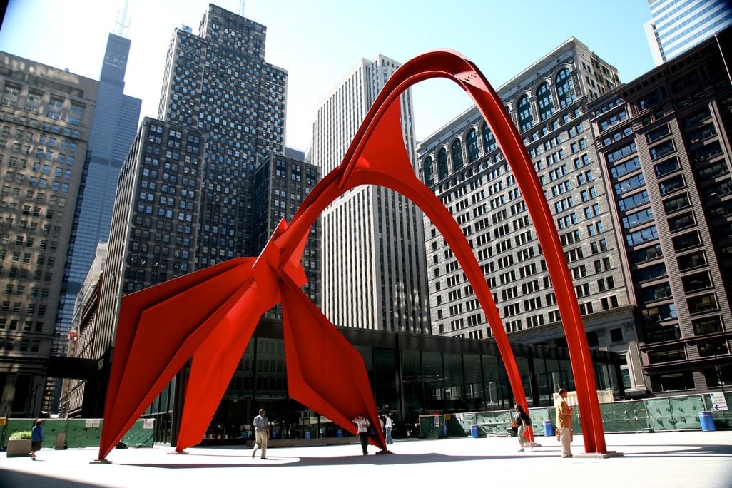 abstract red sculpture in city square
